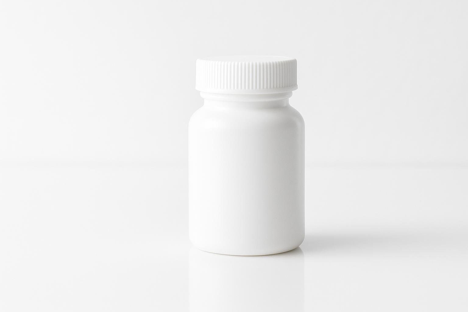 A generic prescription pill bottle on a clean surface.