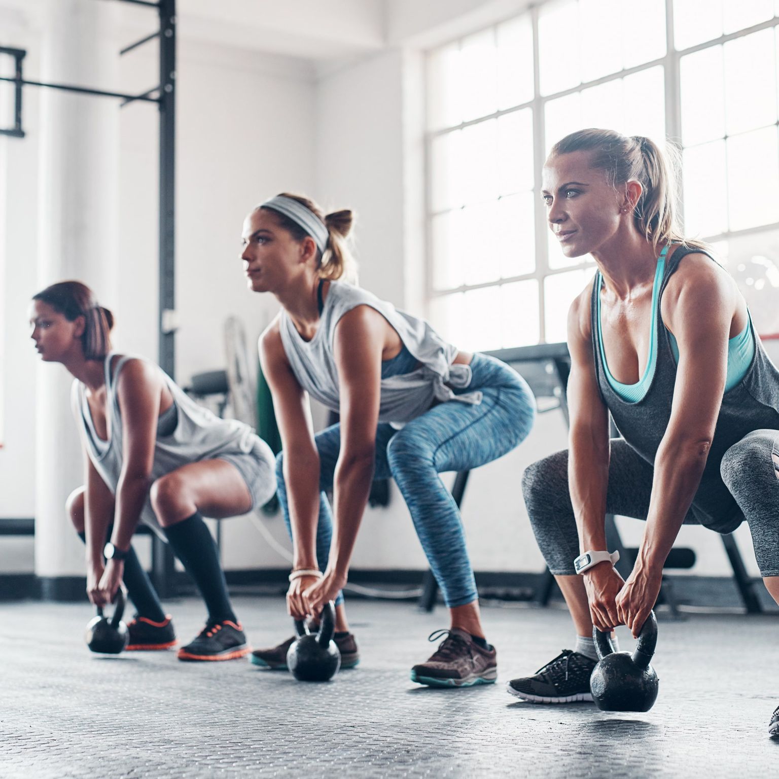 HalfImage: Women Weighted Squats
