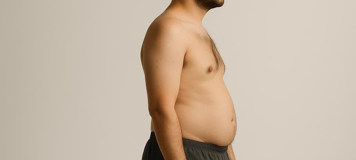 Side profile of a man with a body fat percentage around 20%, showing a normal and healthy physique, and some body hair.