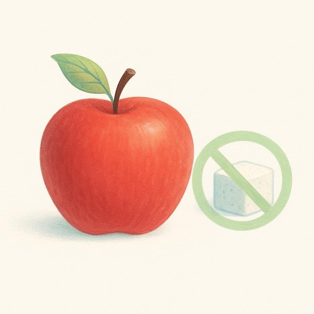 An apple next to a crossed-out sugar cube, representing choosing fruit over added sugar.
